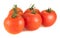 Five fresh tomatoes on a white background