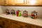Five Glass Containers On Laundry Room Counter