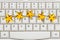 Five gold stars on a keyboard