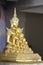 Five golden buddha statues sitting well alignment and decorated with fine jewelry and gold attractive mirror