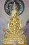 Five golden buddha statues sitting well alignment and decorated with fine jewelry and gold attractive mirror