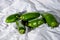 Five green hot jalapeno peppers