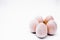 Five hand-made unpainted wooden eggs on a white background