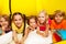 Five happy kids laying in tent and smile