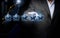 Five holographic stars and a man`s hand on a dark blue background. Business evaluation concept by users, rating and voting