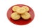 Five homemade mince pies on a festive red plate