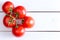 Five Hydroponic tomatoes over white wooden table