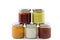 Five jars filled with various sauces