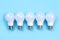 Five LED bulbs on blue background. Saving energy concept.