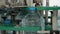 Five-liter bottles on the capping machine. Drinking Water Production Line at Food Processing Plant