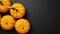 Five mini pumpkins on a black background