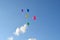 Five multicolored balloons in the blue sky