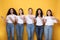 Five Multiracial Women Pointing Fingers Aside Advertising Something, Studio Shot