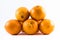 Five nicely colored oranges on a white background - front and back next to each other