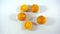 Five oranges on white background