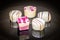 Five piece of bonbons 5 pieces of white chocolate on the plate with pink decoration