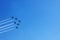 Five planes flying over the blue sky background. Air show at Chisinau National Airport in Moldova. Airplanes with dense decorative