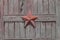 Five-pointed star on the wooden gate
