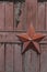 Five-pointed star on the wooden gate