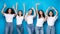 Five Positive Young Women Gesturing Different Signs Over Blue Background