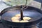 Five potato pancakes fried in a large frying pan