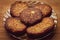 Five potato patties lie in a glass plate