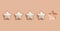 Five rating stars. Glossy reviews stars on peach background. Customer feedback or customer review concepts