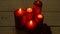 Five red candles light flame on white wood table, romantic theme