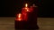 Five red candles light flame on white wood table, romantic theme
