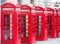 Five Red London Telephone boxes all in a row