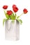 Five red tulips in silver paper bag
