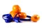 Five ripe sweet mandarins with blue ribbon