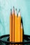 Five simple pencils blue background with copy space. selective focus