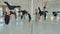 Five slim women team pole dance training in dance hall