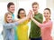 Five smiling students giving high five at school