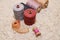 Five spools of thread, meter, spool of pink thread with a needle lie on a white background