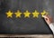 Five star customer feedback or client service rating on blackboard