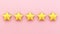 five stars on pink background