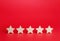 Five stars on a red background. Rating evaluation concept. Service quality feedback. High satisfaction. Good reputation