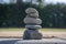 Five stones cairn tower, rock zen sculpture, brown beige pebbles