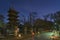 Five storied pagoda and illuminated stone lanterns in Ueno Tosho-gu shrine at night.