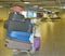 Five Suitcases stacked on top of each other depicting difficulties traveling with lots of luggage