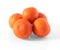 Five tangerines on a white background