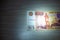 Five thousand rubles banknote lies on a table lit by a ray of light