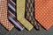 Five ties with a gray background.