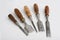 Five vintage chisels with shop made turned hardwoo