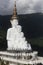 Five white buddha statues sitting well alignment in front of blue sky and decorating wonderful attractive mirror