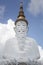 Five white buddha statues sitting well alignment in front of blue sky and decorating wonderful attractive mirror