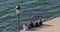 Five women friends admiring the sea