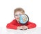 The five-year-old boy in blue points sits at a white table and holds the globe in hand